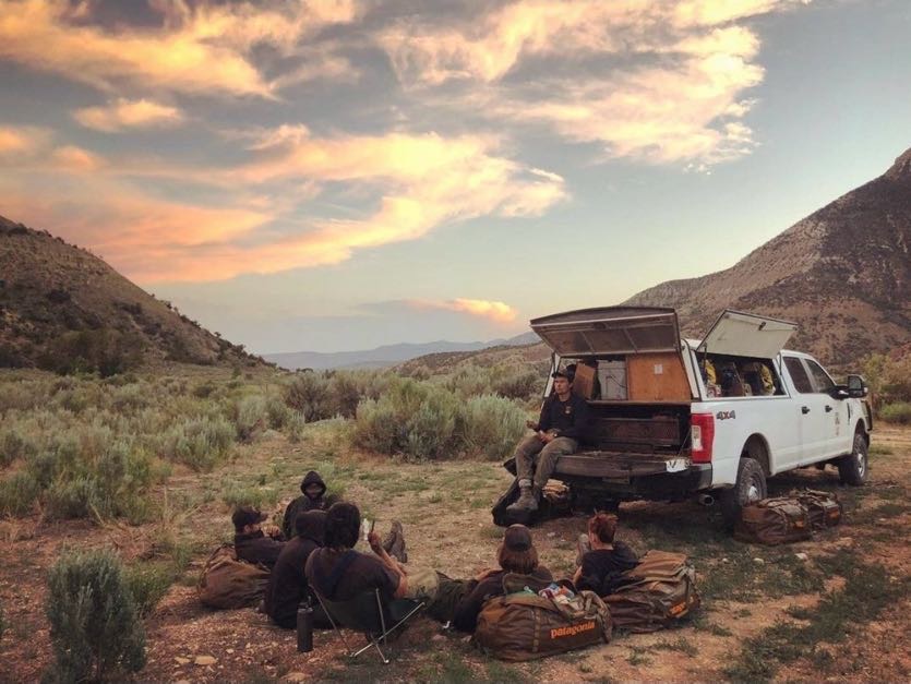 Image of Wildland fire handcrew on break around their truck